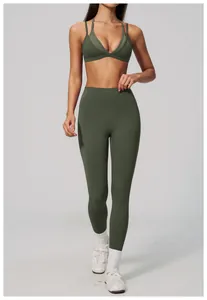 Full body view of women's olive green high-waisted compression leggings and sports bra set