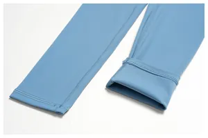 Detail shot of light blue yoga leggings showing durable stitching and soft fabric texture.