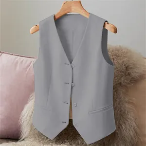 Detailed view of grey women's V-neck suit vest with four buttons and side pockets.