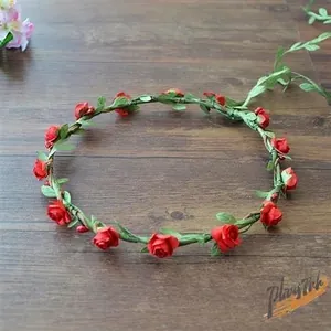 Detailed view of a handmade red rose flower garland for bridal or holiday photography