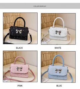 Detailed view of bow square handbags in four colors: black, white, pink, and blue