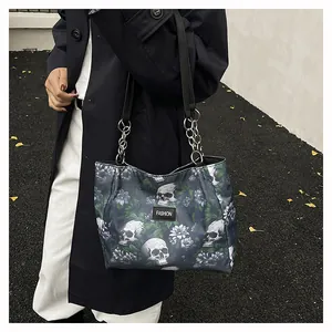 Detailed view of skull and floral print on a large capacity tote bag with chain strap