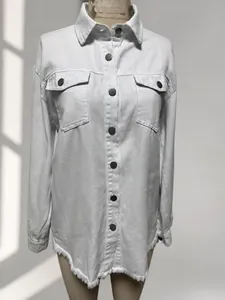 Close-up of white denim jacket featuring buttons and frayed hem edge for women
