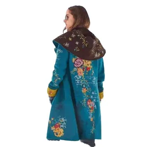 Detailed back view of a teal long coat with exquisite floral embroidery and hood