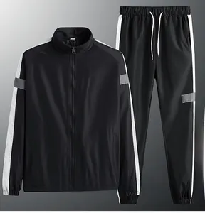 Ensemble de survêtement noir haut de gamme avec veste et pantalon à rayures