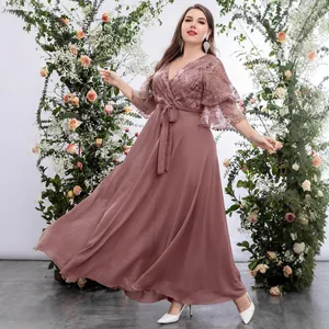 Plus size V-neck evening gown with butterfly sleeves and floral embroidery.