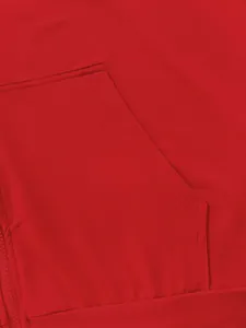 Close-up detail showing the fine stitching and fabric of a red hoodie kangaroo pocket