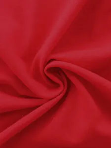 Detailed close-up of vibrant red knit fabric texture for men's athletic tracksuit