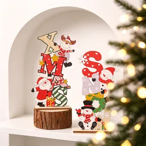 Close-up of colorful wooden Christmas letter ornaments with Santa and Snowman characters