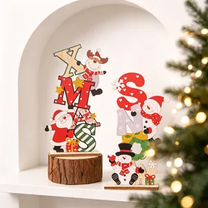 Close-up of colorful wooden Christmas letter ornaments with Santa and Snowman designs