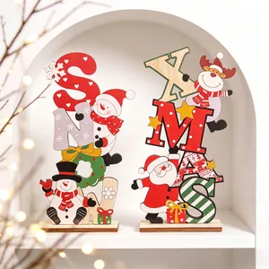 Close-up of colorful wooden SNOW and XMAS letter ornaments for Christmas decoration.