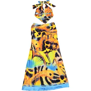Detail view of the vibrant butterfly print on this halter neck top and long skirt set.