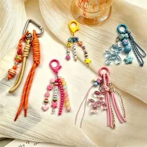 Detailed view of colorful Bohemian style keychains featuring beads and tassels
