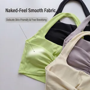 Detail view of ruched halter sports bra fabric in multiple pastel colors with soft padding
