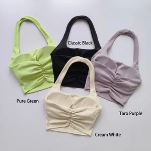 Four colors of halter neck sports bras featuring gathered front and padded support.