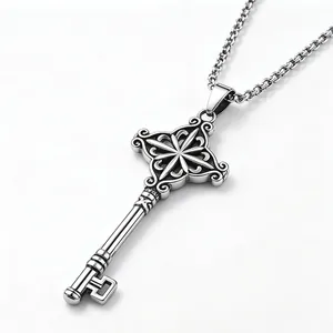 Detailed macro shot of a vintage-style stainless steel key pendant necklace on white.