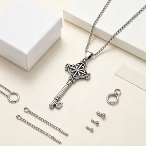 Detailed view of a vintage stainless steel key pendant necklace with assembly parts.