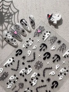 Detail shot of Halloween ghost and spider web nail art stickers on a sheet YT6744.