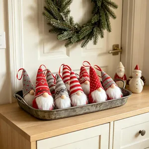 Knitted Christmas gnome ornaments set in a rustic metal tray for festive home decor