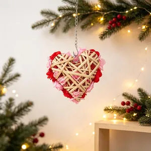 Romantic heart-shaped rattan wreath with artificial red and pink roses for wall decor