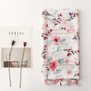 Floral cotton linen feel scarf with pink flower print and tassel edge details
