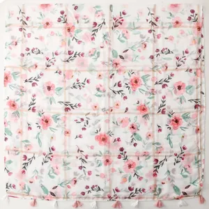 Macro detail of white floral scarf with silver thread tassels and elegant grid pattern