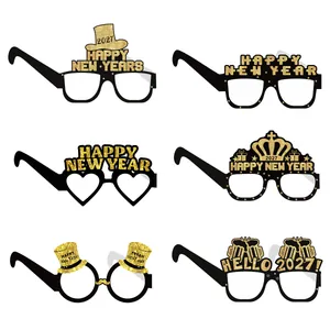 Detail view showing six unique 2027 New Year party paper glasses for photo booth props.
