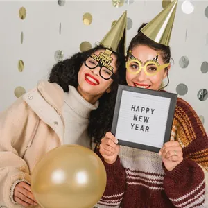 Festive 2027 Happy New Year paper party glasses shown in a celebratory party scene.