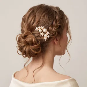 Detailed view of an elegant gold pearl hair pin styled in a classic bridal bun hairstyle