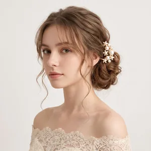 Detail view of a vintage gold hairpin with clustered white pearls in an elegant bun