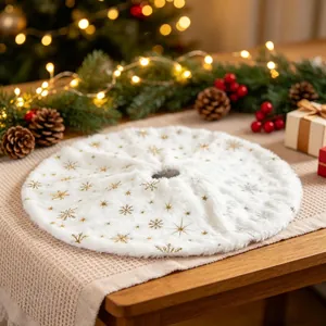 White faux fur Christmas tree skirt decorated with gold and silver snowflake patterns