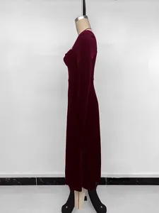 Side profile of an elegant wine red velvet long-sleeved dress with a square neckline