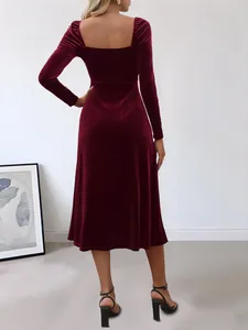 Elegant burgundy velvet long sleeve dress with square neck, featuring a back view detail.