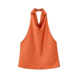 Close-up of elegant burnt orange satin halter neck top with cowl neckline
