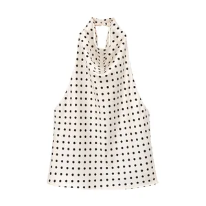 Detailed view of fashion satin halter neck top with black polka dot pattern