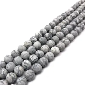 Macro view of matte grey striped natural map stone loose beads for DIY jewelry making.
