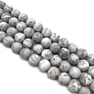 Detailed macro view of matte grey and white striped map stone round loose beads for DIY jewelry.