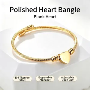 Engravable gold-plated 304 stainless steel twisted wire bangle with heart charm detail