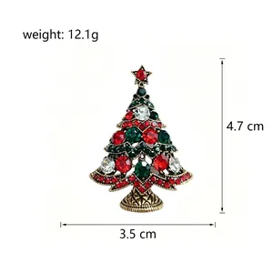 Close-up view of a rhinestone Christmas tree brooch showing 4.7 x 3.5 cm dimensions.