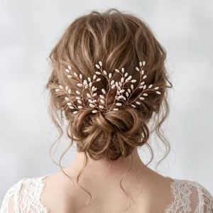 Detail of handmade bridal hair vine with white pearls in a romantic bun hairstyle.