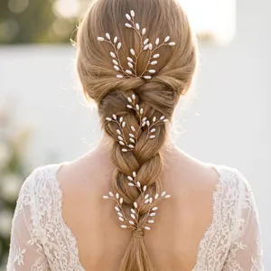 Back view of a braided hairstyle decorated with elegant handmade pearl hair vines