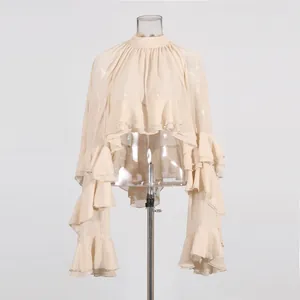 Front view of mesh blouse showcasing intricate ruffled layers and high neck design