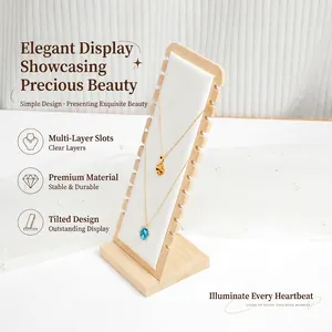 Bamboo necklace display stand with white leather lining and multiple slots.