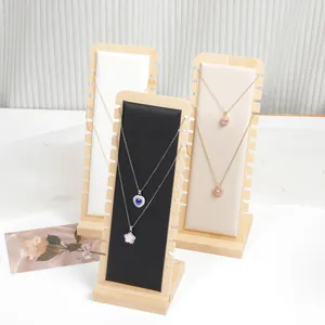 Premium bamboo and wood necklace display stands with padded inserts for jewelry exhibition