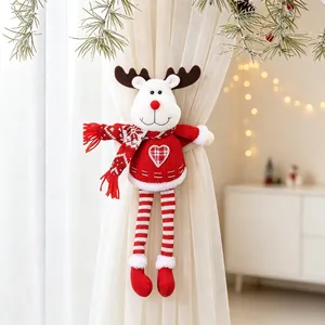 Close-up detail of a plush reindeer Christmas curtain tieback on white sheer curtains