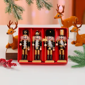 Detailed set of 4 wooden nutcracker figurines in a festive red gift box for Christmas decor.