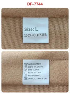 Detail view of men's suit care label with size L and 100% polyester fabric texture