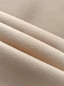 Vue macro détaillée de la texture du tissu en laine beige doux pour costume homme