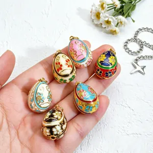 Handcrafted colorful enamel egg pendants featuring intricate vintage floral patterns