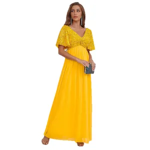 Robe longue jaune élégante avec haut à paillettes et jupe en mousseline pour les fêtes